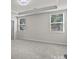 Spacious main bedroom with tray ceilings, ample natural light, and a comfortable ambiance for relaxation and retreat at 5024 Colline Ct, Charlotte, NC 28216