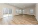 Bright living room with hardwood floors, natural light, and sliding glass door leading to outdoor space at 5025 Poplin Vly, Cherryville, NC 28021