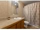 Bathroom featuring a sink vanity and a shower with patterned curtain at 5039 Pine Springs Dr, Bessemer City, NC 28016