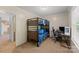 Bedroom featuring a bunk bed and a desk with computer at 5039 Pine Springs Dr, Bessemer City, NC 28016