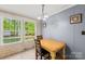 Cozy dining area with natural light, table with seating for two, and pleasant backyard view at 5039 Pine Springs Dr, Bessemer City, NC 28016