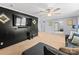 Relaxing living area featuring neutral carpeting and a modern entertainment center at 5039 Pine Springs Dr, Bessemer City, NC 28016