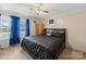 Comfortable main bedroom featuring neutral walls, dark wood furnishings, and light-blocking curtains at 5039 Pine Springs Dr, Bessemer City, NC 28016