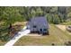 Single Gathering home featuring covered porch and three-car garage on manicured lawn at 515 Edmunds Ln # 38, Clover, SC 29710