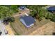 Aerial view of a gray home with a dark roof and lush landscaping in a well-maintained neighborhood at 515 Edmunds Ln # 38, Clover, SC 29710