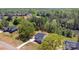 Expansive aerial view of a home with a gray roof, long driveway, and surrounding lush greenery at 515 Edmunds Ln # 38, Clover, SC 29710