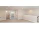 Bright bonus room with neutral walls, carpeted floors, and a glimpse into the adjacent bathroom and bedroom at 515 Edmunds Ln # 38, Clover, SC 29710