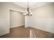 Dining room featuring hardwood floors, board and batten, and modern chandelier at 515 Edmunds Ln # 38, Clover, SC 29710