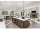 Modern kitchen features a large island, pendant lighting, and views into the living area at 515 Edmunds Ln # 38, Clover, SC 29710