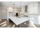 A modern kitchen with stainless steel appliances, a large island, and white cabinets at 515 Edmunds Ln # 38, Clover, SC 29710