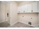 Well-appointed laundry room with ample cabinet space and modern fixtures, offering convenience and style at 515 Edmunds Ln # 38, Clover, SC 29710