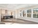 Bright living room featuring hardwood floors, coffered ceilings, and large windows overlooking the backyard at 515 Edmunds Ln # 38, Clover, SC 29710