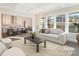 Bright living room with a comfortable couch and view to the modern kitchen and large windows at 515 Edmunds Ln # 38, Clover, SC 29710