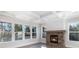 Cozy living room with stone fireplace, abundant natural light, and coffered ceilings at 515 Edmunds Ln # 38, Clover, SC 29710