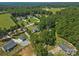 Scenic aerial view of a neighborhood surrounded by lush green forests at 5159 Taxahaw Rd, Lancaster, SC 29720