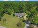 Charming home with a well-maintained lawn, mature trees, and a detached carport in a peaceful, wooded setting at 5159 Taxahaw Rd, Lancaster, SC 29720
