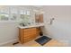 Bathroom featuring tiled floors and walls, vanity, a large mirror with lighting, and a window with blinds at 5159 Taxahaw Rd, Lancaster, SC 29720