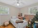 Bedroom featuring hardwood floors, window with blinds, and is currently being used for storage at 5159 Taxahaw Rd, Lancaster, SC 29720