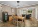 Cozy dining area adjacent to the living room with a view of the fireplace at 5159 Taxahaw Rd, Lancaster, SC 29720