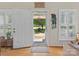 Bright entryway with white door, decorative accents, and clear view to the front yard at 5159 Taxahaw Rd, Lancaster, SC 29720