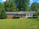 Charming single story home featuring a well-manicured lawn and inviting front porch at 5159 Taxahaw Rd, Lancaster, SC 29720