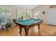Well-lit game room features a beautifully crafted pool table at 5159 Taxahaw Rd, Lancaster, SC 29720