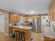 Well-lit kitchen with stainless steel appliances, breakfast bar, and ample counter space at 5159 Taxahaw Rd, Lancaster, SC 29720