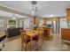 Open concept with a dining area seamlessly connected to the kitchen and living room at 5159 Taxahaw Rd, Lancaster, SC 29720