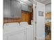 Laundry room with gray cabinets and white washer and dryer at 5159 Taxahaw Rd, Lancaster, SC 29720