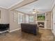 Inviting living room features a fireplace, neutral walls, and abundant natural light at 5159 Taxahaw Rd, Lancaster, SC 29720