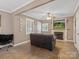 Inviting living room features a fireplace, neutral walls, and abundant natural light at 5159 Taxahaw Rd, Lancaster, SC 29720