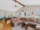 Spacious living room featuring hardwood floors, sectional seating, and a pool table for entertainment at 5159 Taxahaw Rd, Lancaster, SC 29720