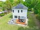 Aerial view of a home with a backyard featuring a patio, gazebo, and well-maintained lawn at 5227 Pinebrook Dr, Charlotte, NC 28208