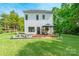 Large backyard with a patio, gazebo, and seating area, ideal for outdoor entertaining and relaxation at 5227 Pinebrook Dr, Charlotte, NC 28208