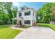 Inviting exterior of a two-story home featuring manicured lawn, newly paved driveway and modern architectural details at 5227 Pinebrook Dr, Charlotte, NC 28208