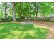 Cozy backyard fire pit area with seating, perfect for enjoying evenings outdoors at 5227 Pinebrook Dr, Charlotte, NC 28208