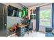 Well-lit home office featuring a large screen tv, comfortable desk chair, and great natural light at 5227 Pinebrook Dr, Charlotte, NC 28208