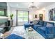 Bright and airy living room featuring a modern fireplace, plush sofa, and large windows offering serene outdoor views at 5227 Pinebrook Dr, Charlotte, NC 28208