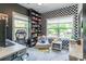 Bright office space featuring checkerboard accent wall, carpet and large windows at 5227 Pinebrook Dr, Charlotte, NC 28208