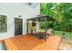 Outdoor seating area with a wood deck and gazebo, perfect for enjoying the surrounding greenery at 5227 Pinebrook Dr, Charlotte, NC 28208