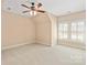 This carpeted bedroom features a ceiling fan, base molding, and shuttered windows for natural light at 5335 Lower Shoal Creek Ct, Charlotte, NC 28277