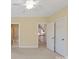 The carpeted bedroom features crown molding, two closets, and a bathroom entrance at 5335 Lower Shoal Creek Ct, Charlotte, NC 28277