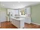 Classic kitchen with a central island cooktop and modern appliances at 5335 Lower Shoal Creek Ct, Charlotte, NC 28277