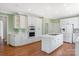 Charming kitchen with white cabinets, island cooktop, and modern appliances at 5335 Lower Shoal Creek Ct, Charlotte, NC 28277