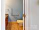 A clean, accessible bathroom with granite countertop and safety bars at 611 Stowe Rd, Clover, SC 29710