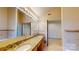 Bathroom with a double vanity and a well-lit mirror are ready for relaxation and convenience at 611 Stowe Rd, Clover, SC 29710