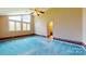 A spacious bedroom is filled with natural light from several windows and a ceiling fan at 611 Stowe Rd, Clover, SC 29710