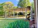 A sturdy backyard carport is ready to handle your vehicles and other yard implements at 611 Stowe Rd, Clover, SC 29710