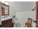 Elegant bathroom featuring a modern sink, toilet, and charming decor elements at 627 S Chapel St, Landis, NC 28088