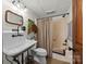 Rustic bathroom with a unique vintage sink, charming fixtures, and a classic bathtub for a cozy feel at 627 S Chapel St, Landis, NC 28088
